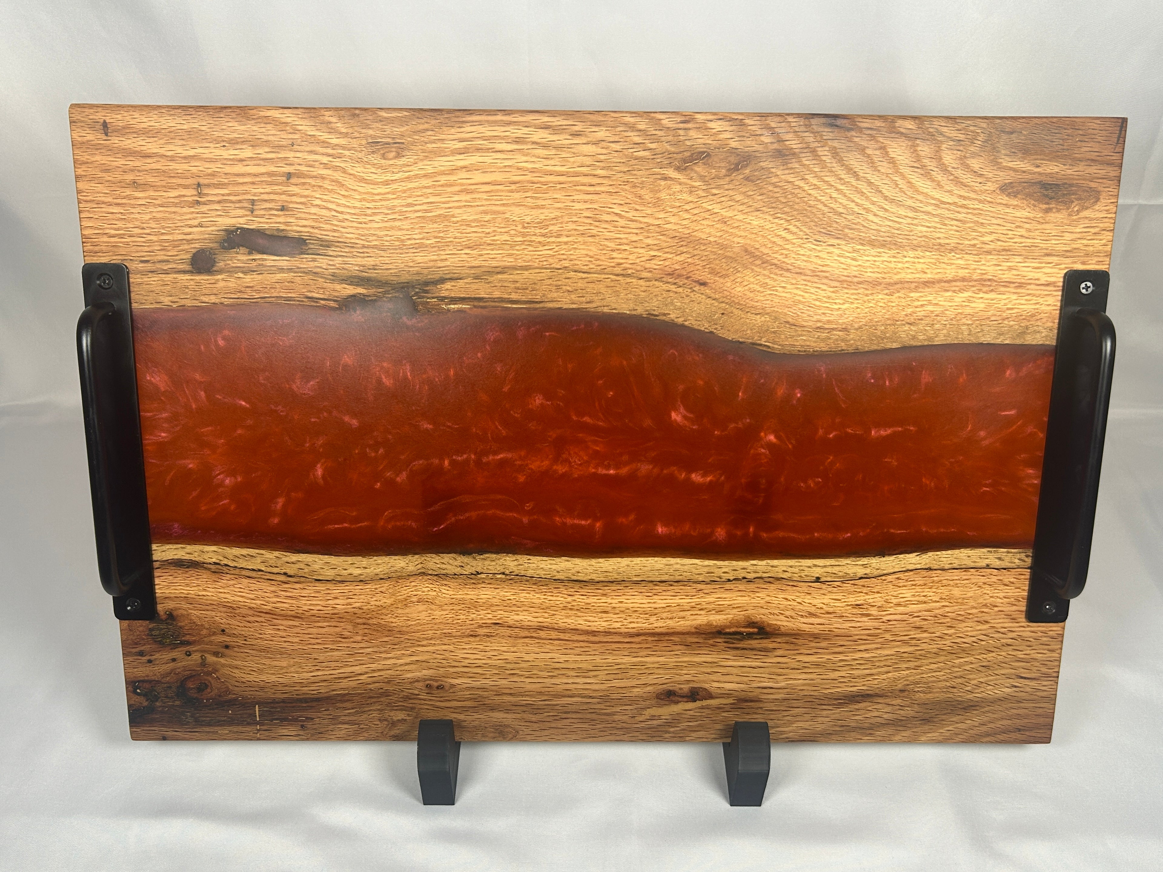 Charcuterie Board, Extra Large, Red Oak, Epoxy Live Edge River, Orange Pearl, Matte Black Handles and Metal Feet with Rubber Ring